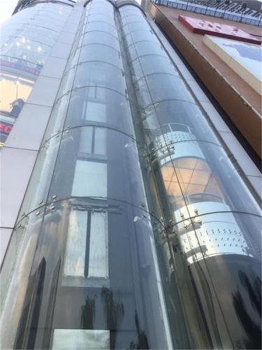 Curved elevator Glass